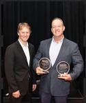 Europlacer's Chris Merow accepts the Service Excellence Awards from PCEA President Mike Buetow.